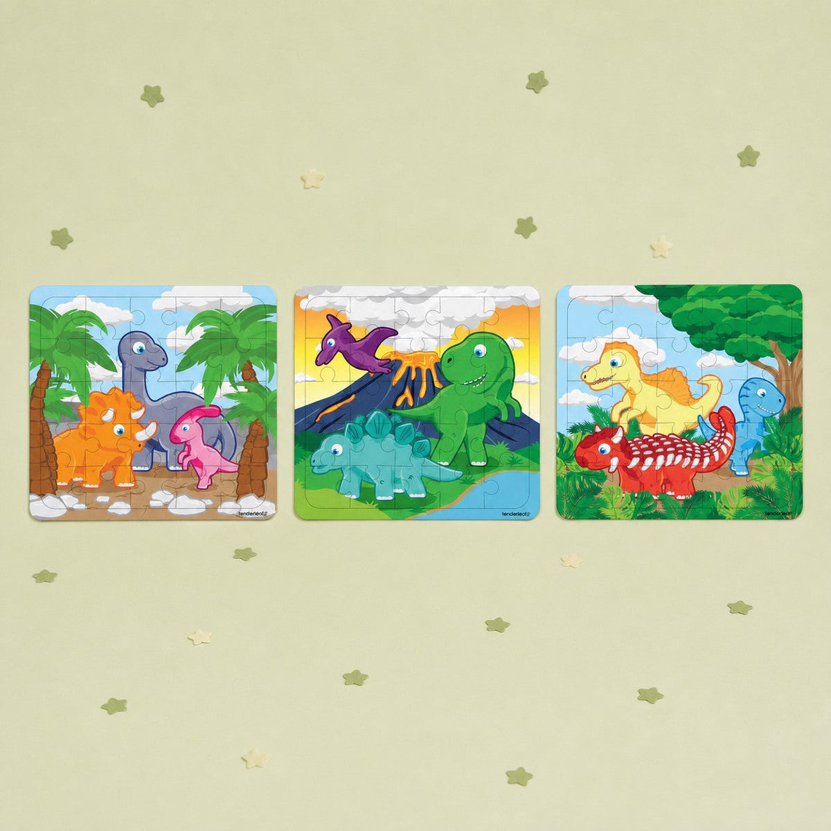 Dinosaur mini puzzle set featuring three colorful prehistoric scenes with cartoon dinosaurs. One puzzle supplied at random.