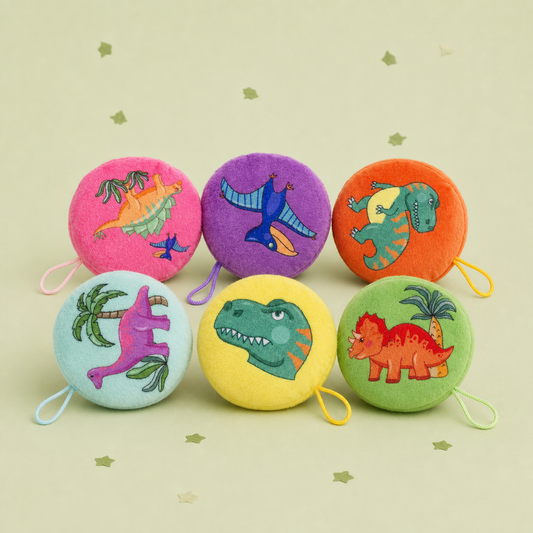 Pickit Parties assorted round dinosaur plush hangers with hanging loops in vibrant colours on a light green background